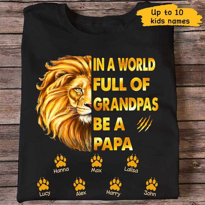 Personalized T-Shirt For Grandpa In A World Full Of Grandpas Be A Papa Lion & Paw Prints Custom Grandkids Name
